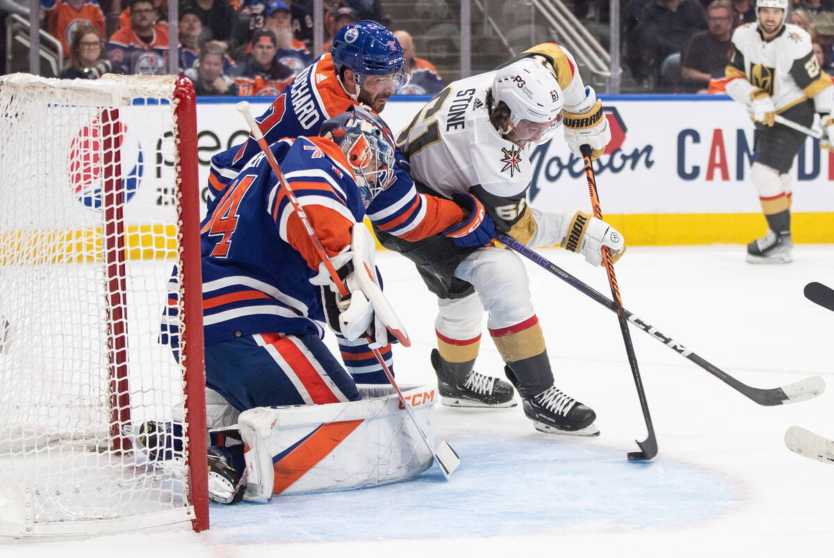 Vegas Golden Knights' Mark Stone (61) is stopped by Edmonton Oilers' goalie Stuart Skinner (74) ...