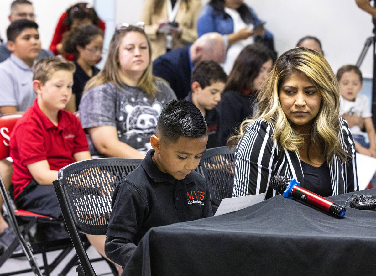 Roman Lomeli, a second grade student at Mountain View Christian School, reads his testimony as ...