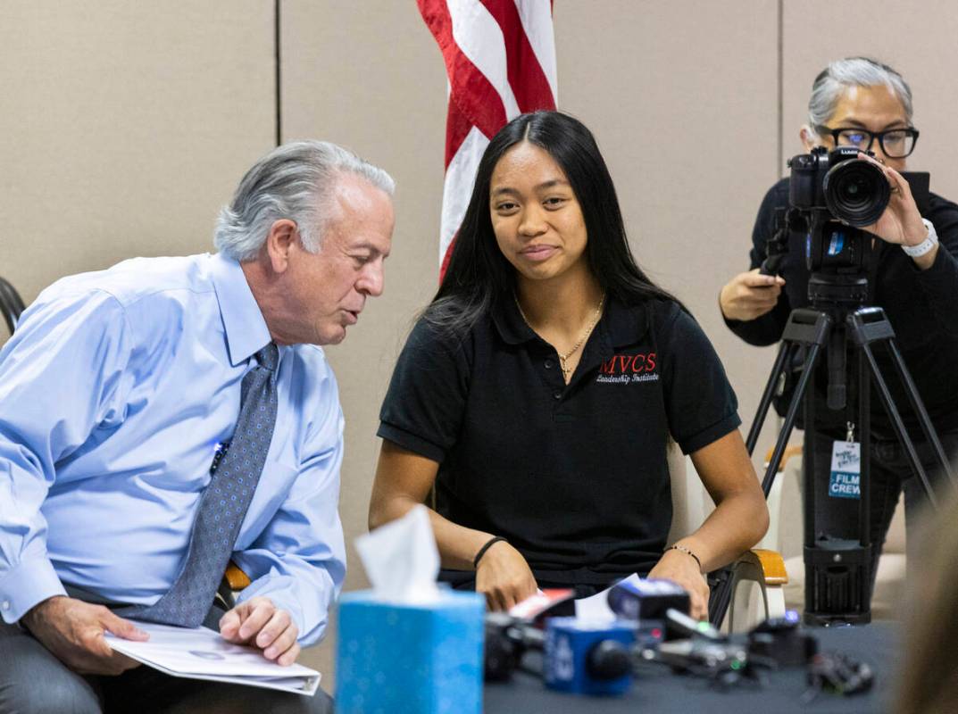 Gov. Joe Lombardo chats with Kristyn Ramos, right, a senior at Mountain View Christian School, ...