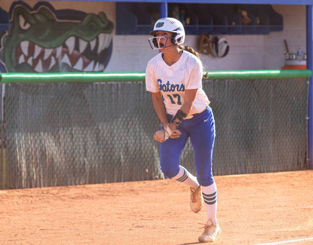 Green Valley High's Mikee Morris reacts after hitting a solo home run against Liberty High duri ...