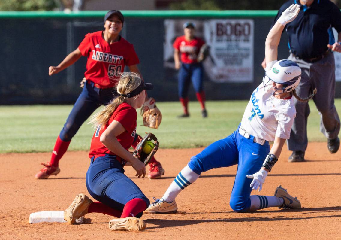 Green Valley High's Aspyn Beattie (7) tagged out at second by Liberty High's Jesse Farrell (17 ...