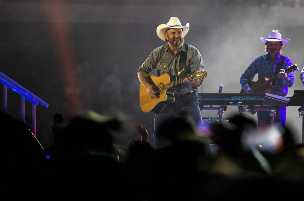 Garth Brooks performs before the crowd at Allegiant Stadium on Friday, July 10 2021, in Las Veg ...