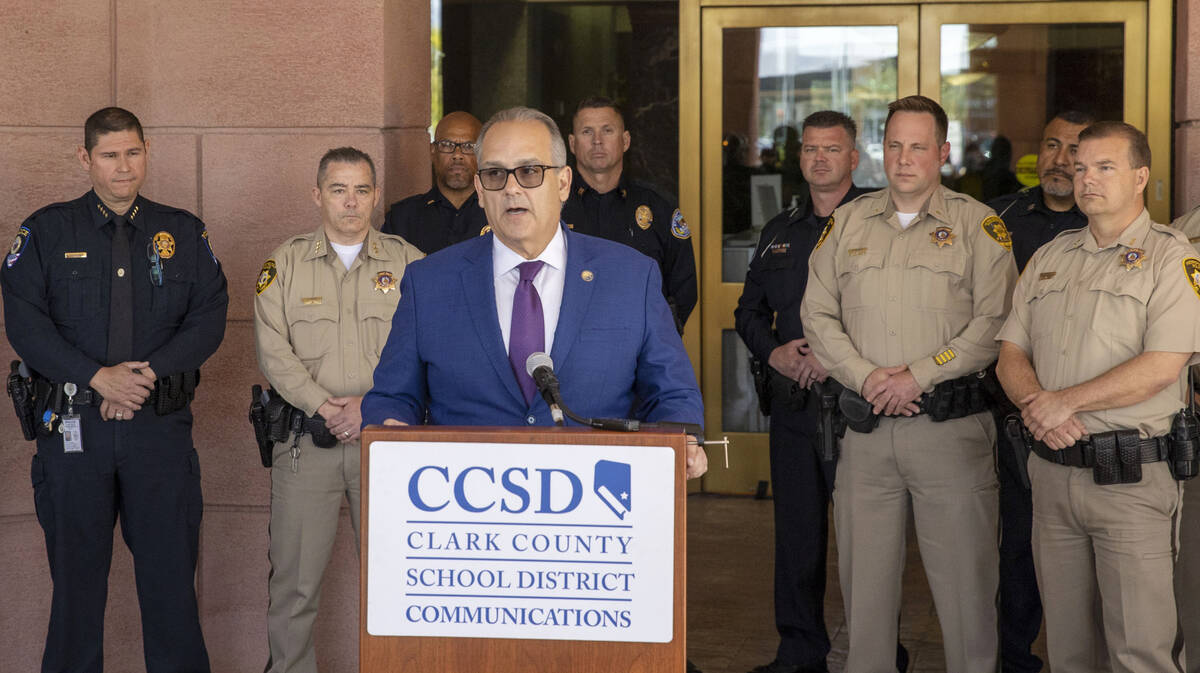 Clark County School District Superintendent Dr. Jesus Jara speaks from the podium with CCSD Pol ...