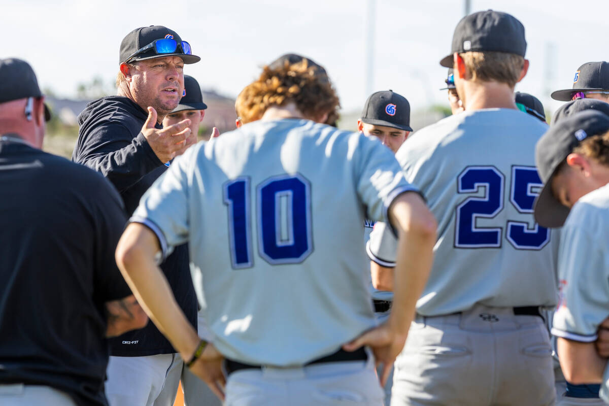 Bishop Gorman coach Chris Sheff counsels his players after beating Centennial 4-3 players durin ...