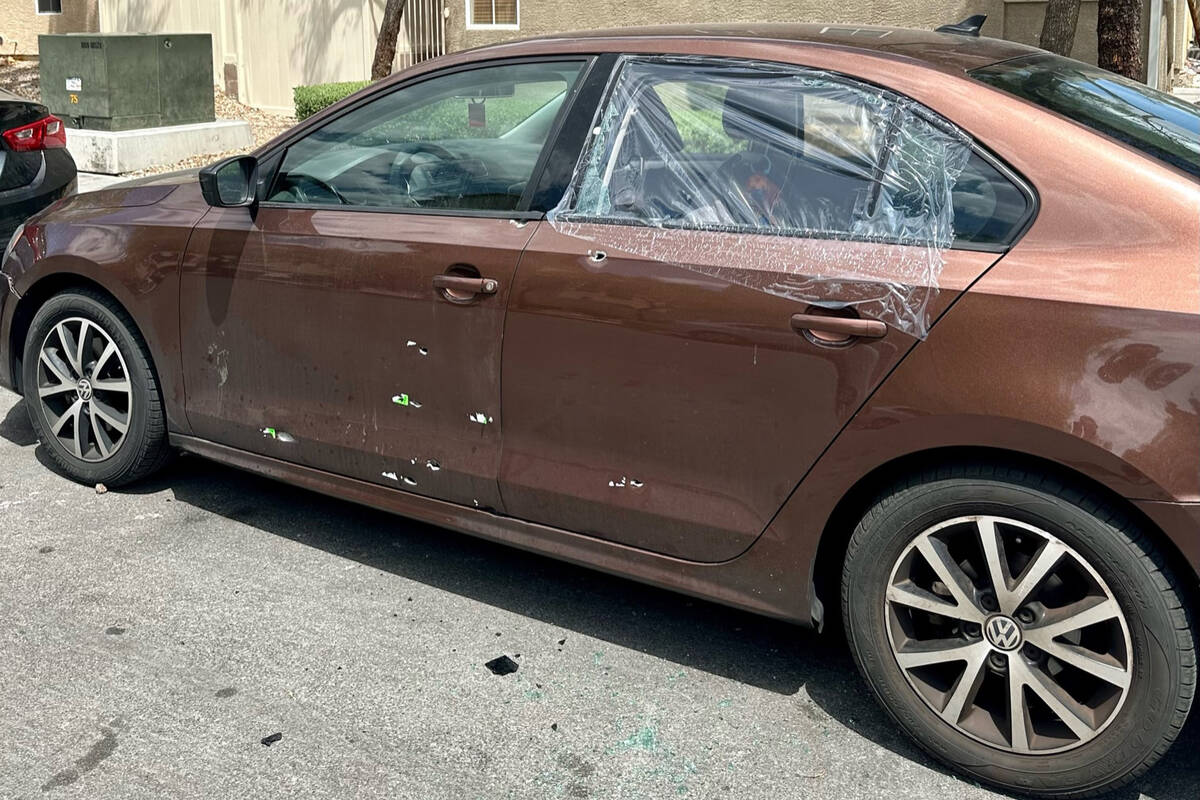 A brown Volkswagen Jetta SE with what appeared to be nine bullet holes was parked on Camille Cr ...