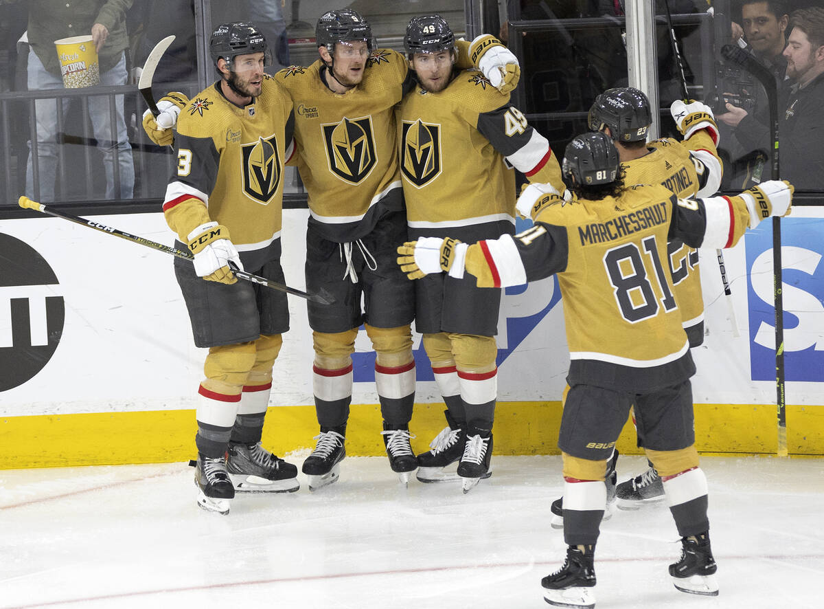 The Golden Knights celebrate after Golden Knights center Jack Eichel (9) scored during the firs ...