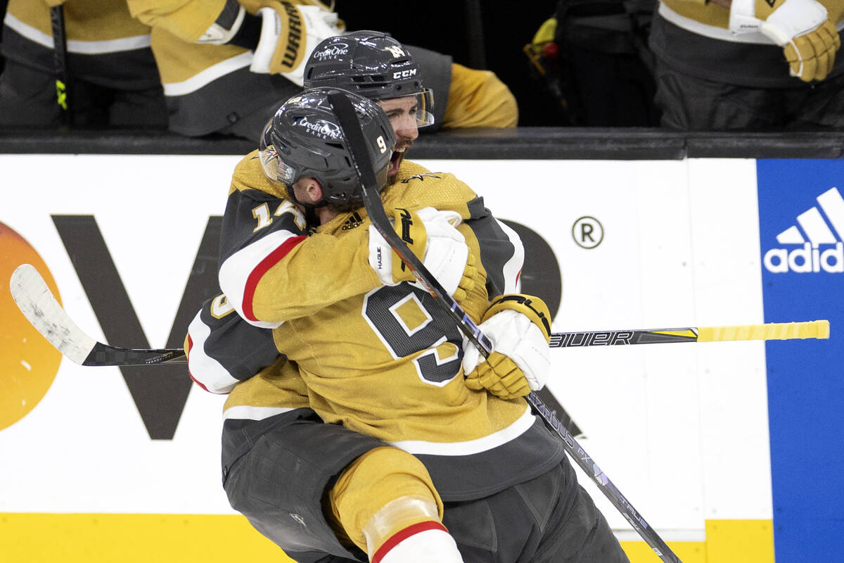 Golden Knights defenseman Nicolas Hague (14) and center Jack Eichel (9) celebrate after Hague s ...