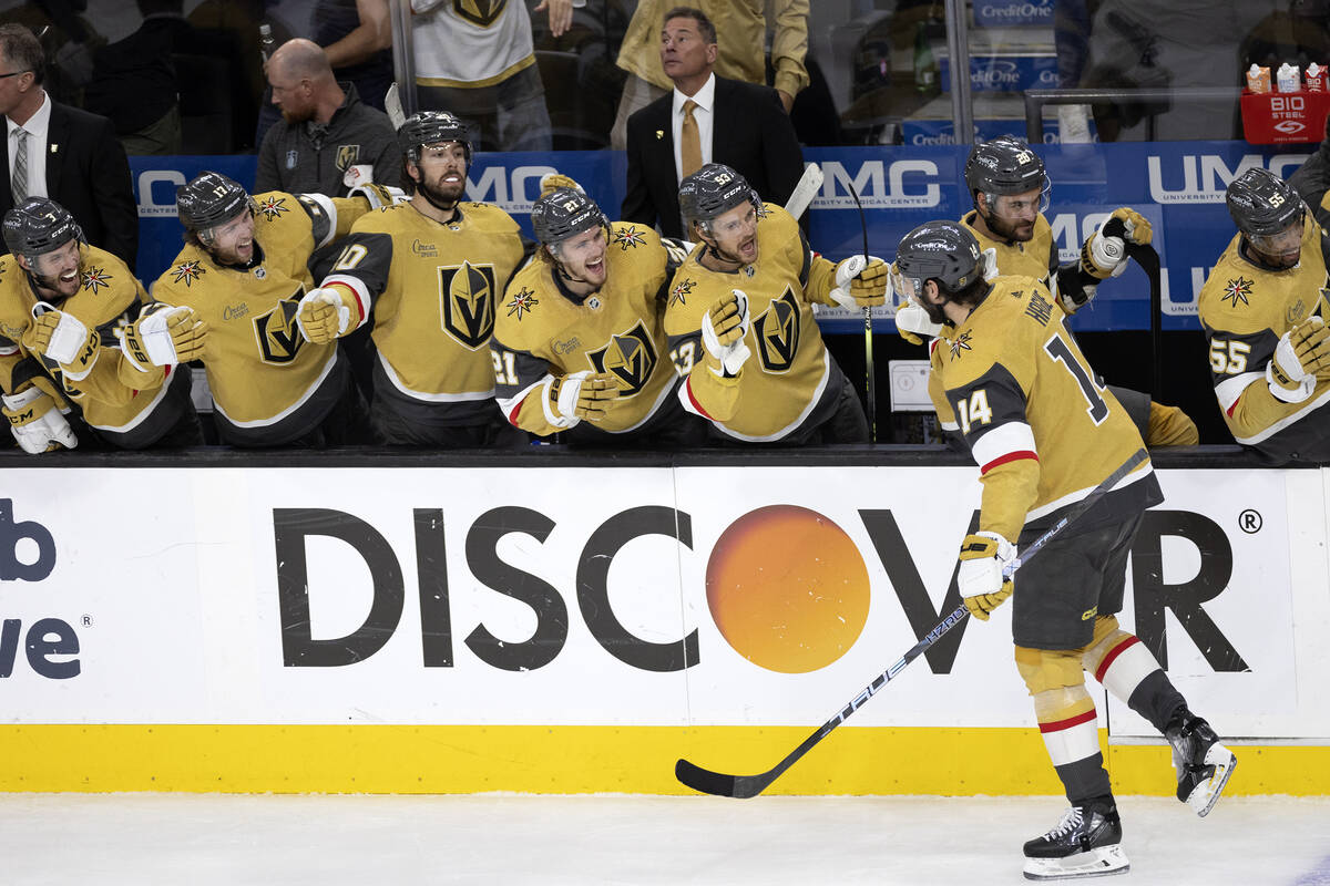 The Golden Knights bench congratulates defenseman Nicolas Hague (14) on his goal during the sec ...