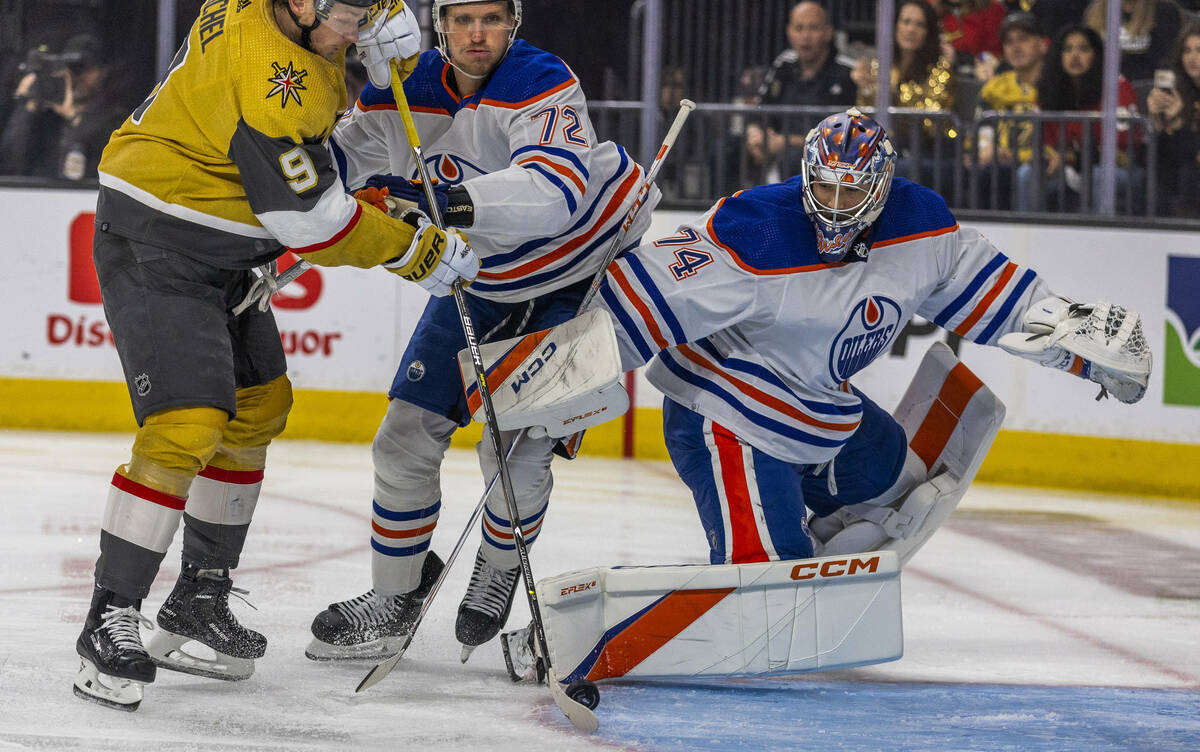 Golden Knights center Jack Eichel (9) readies to score past Edmonton Oilers center Nick Bjugsta ...