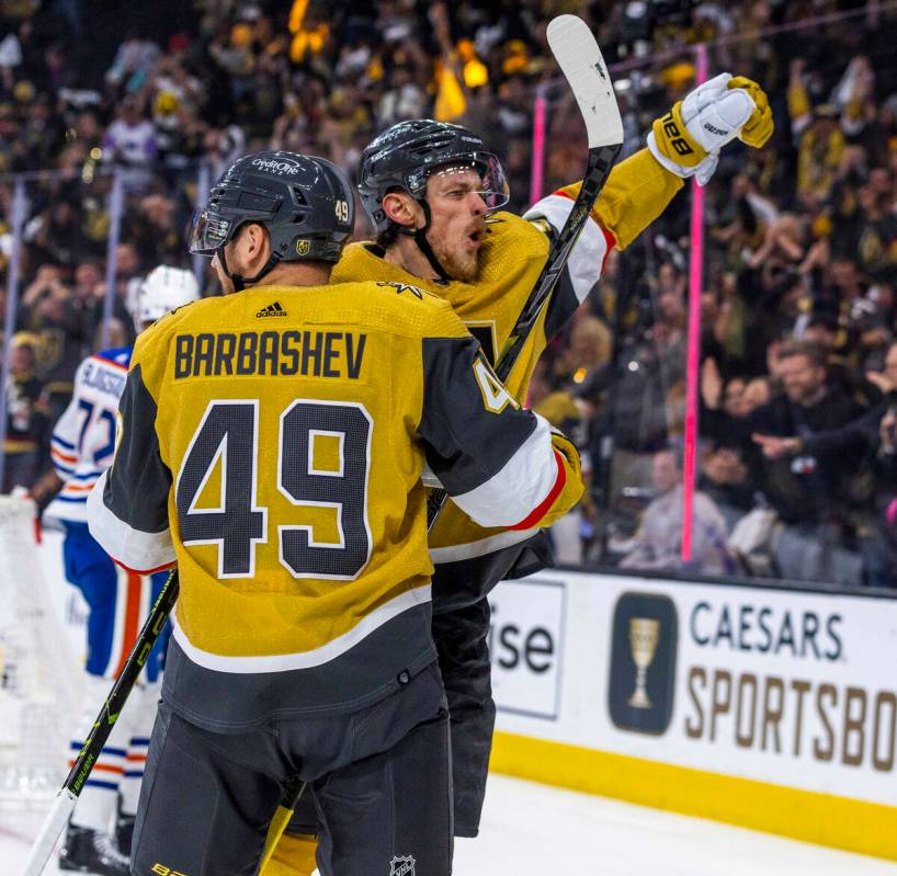 Golden Knights center Jack Eichel (9) celebrates a score with teammate Golden Knights center Iv ...