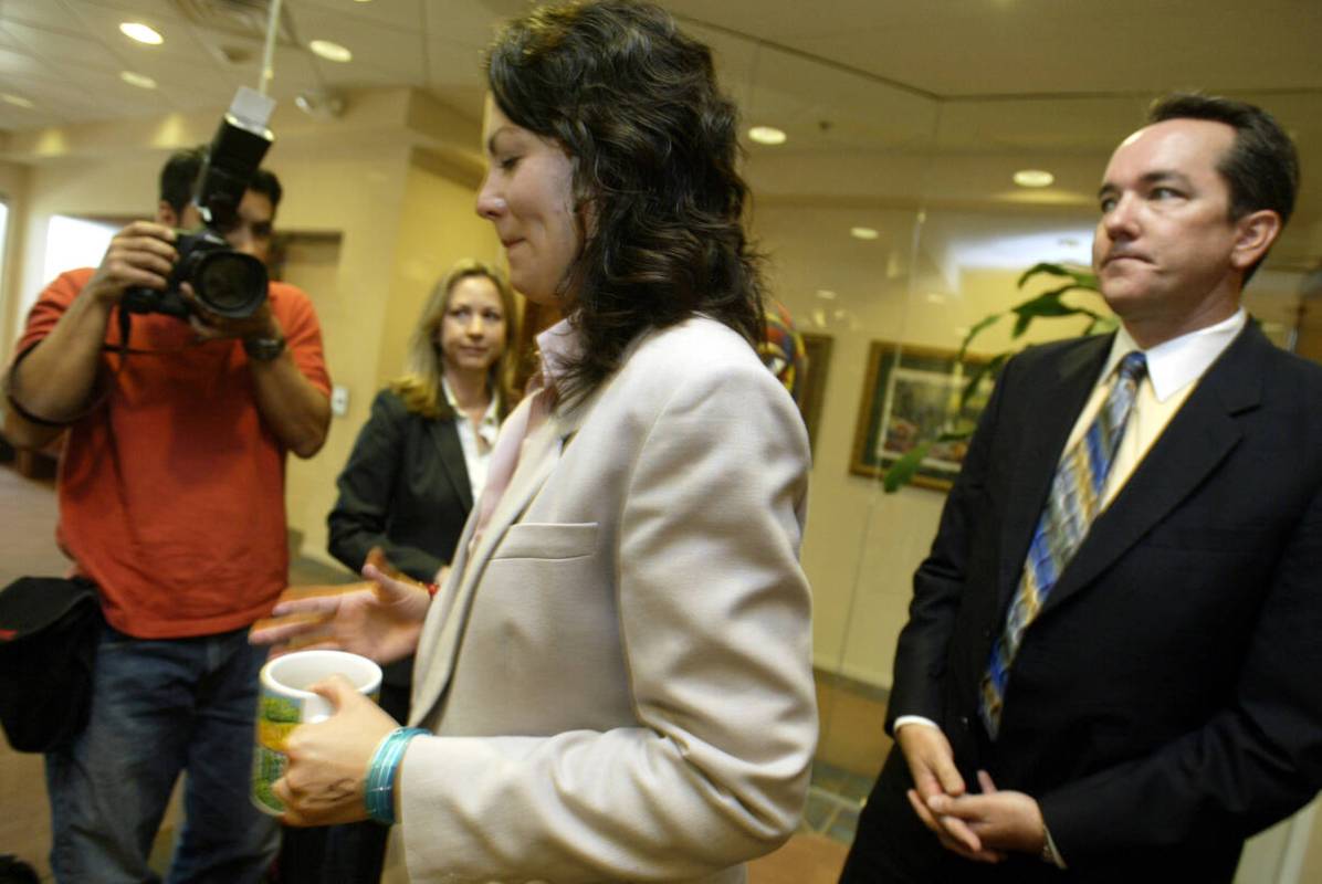 Heather Catherine Tallchief, center, speaks to members of the press before turning herself in t ...