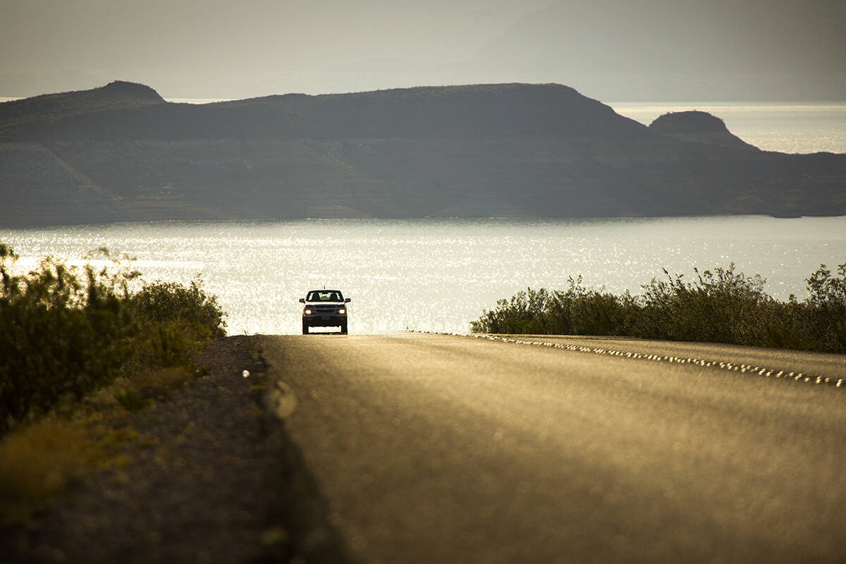 A vehicle travels along Lake Shore Road at Lake Mead National Recreation Area. (Las Vegas Revie ...