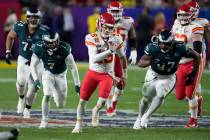 Kansas City Chiefs quarterback Patrick Mahomes (15) runs against the Philadelphia Eagles during ...