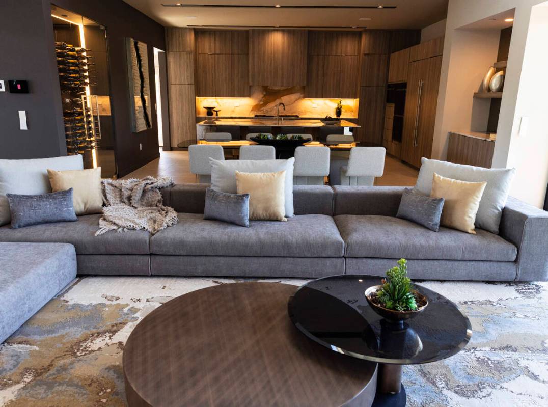 The living room and kitchen are seen in the newly finished house at the Oasi homes, built by Bl ...