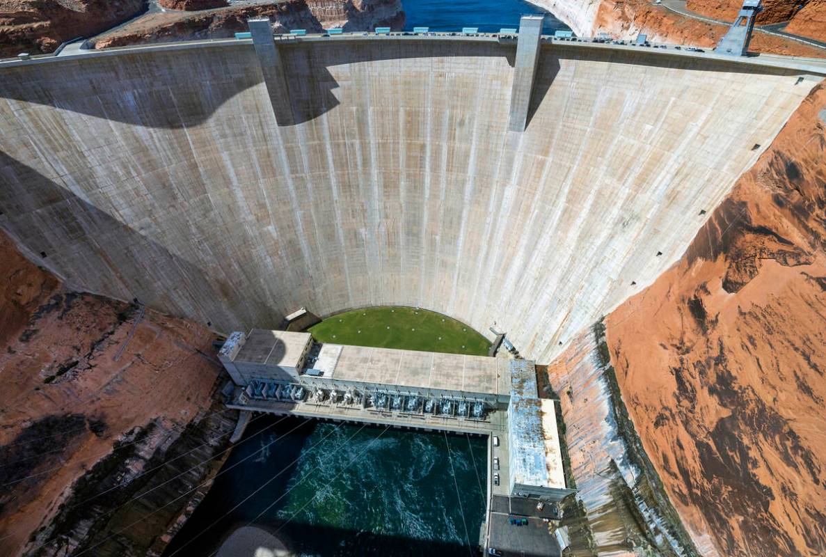 The Glen Canyon Dam with Colorado River flowing out below on Tuesday, April 18, 2023, in Page, ...