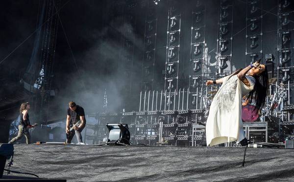 Evanescence lead singer Amy Lee, right, performs with the band during the Sick New World festiv ...