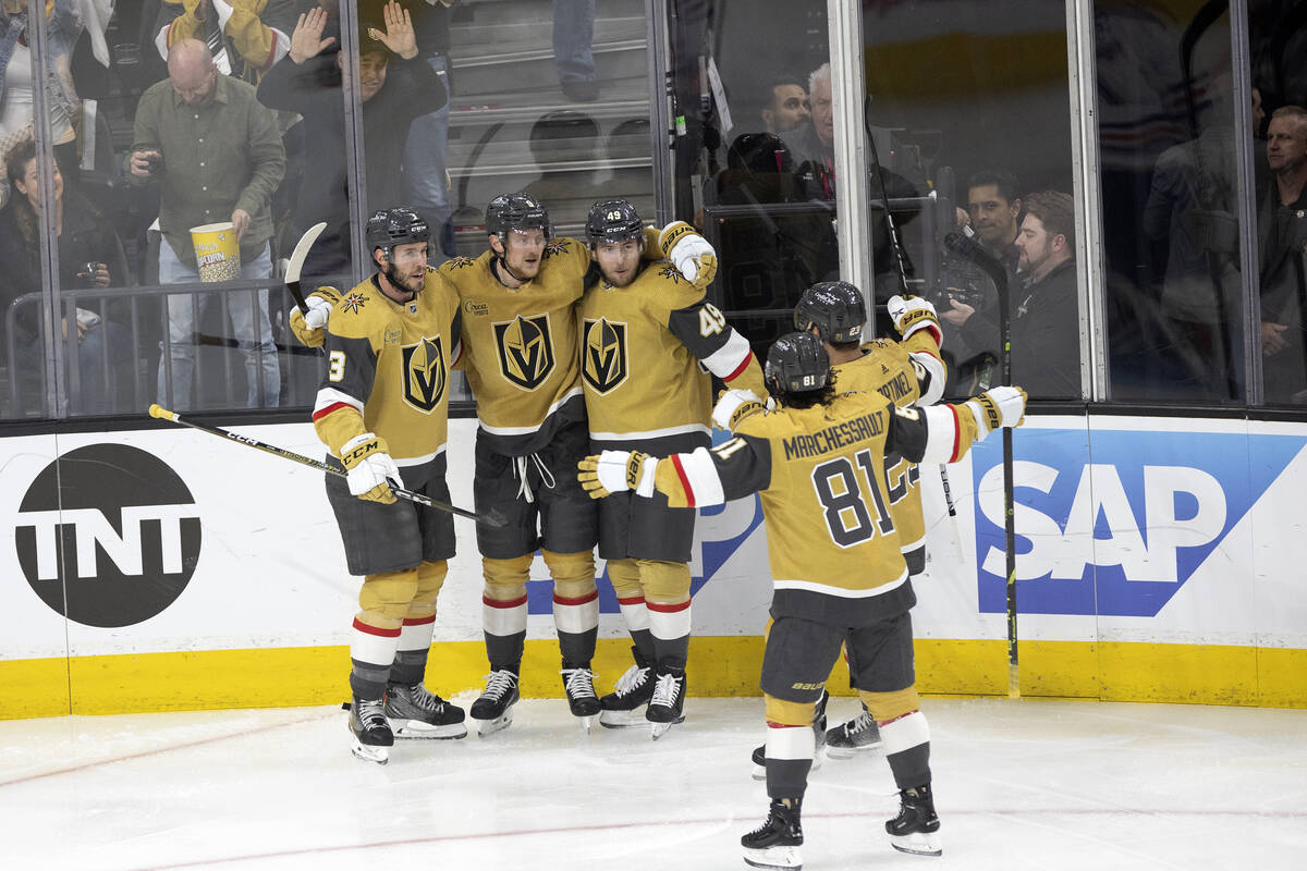 The Golden Knights celebrate after Golden Knights center Jack Eichel (9) scored during the firs ...