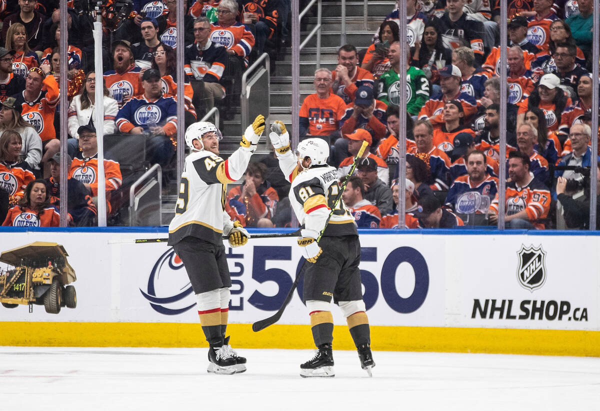 Vegas Golden Knights' Ivan Barbashev (49) and Jonathan Marchessault (81) celebrate Marchessault ...