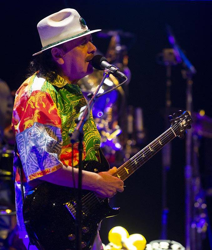 Carlos Santana performs a sound check after a press conference to announce an extension of Sant ...