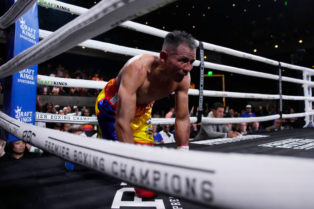 Ismael Barroso kneels on the mat after he was knocked down by Rolando Romero in a super lightwe ...