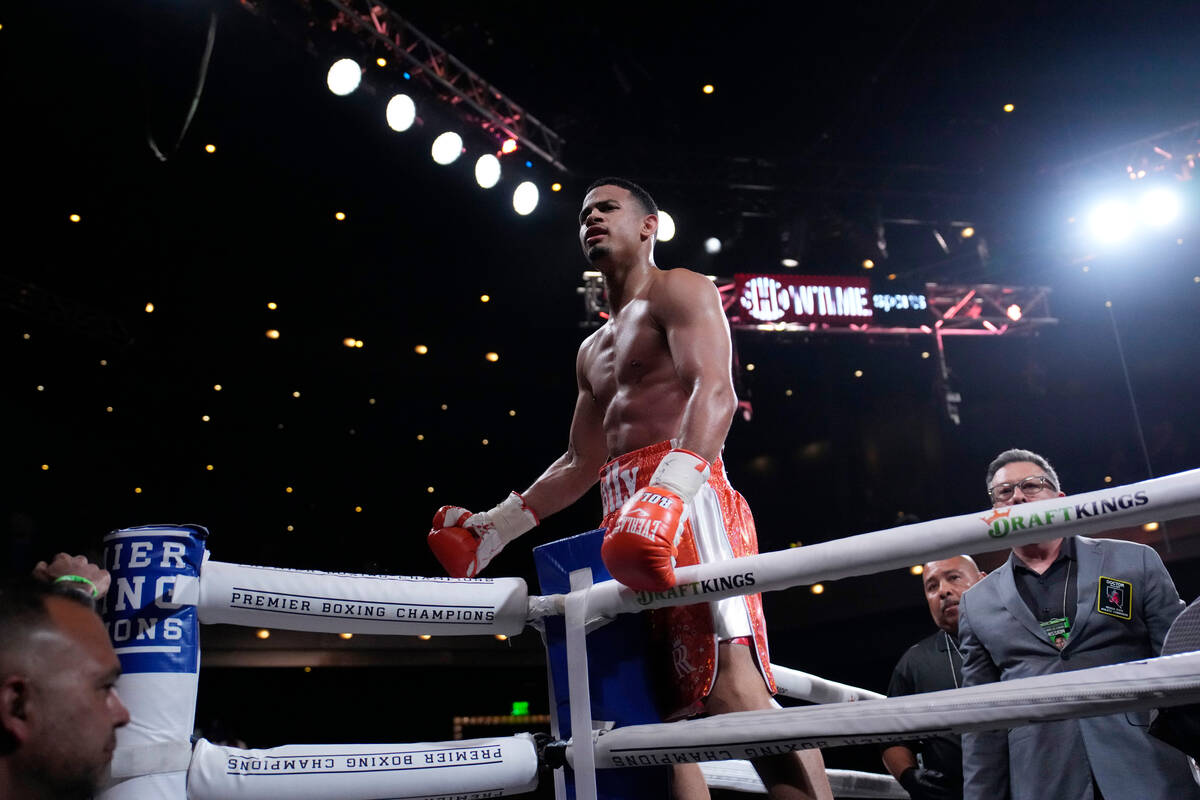 Rolando Romero celebrates after defeating Ismael Barroso in a super lightweight title boxing ma ...