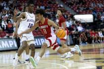 Liberty’s Dedan Thomas (11) drives around Durango’s Tylen Riley (10) during the f ...