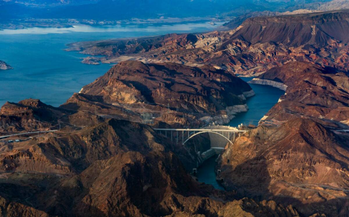 Hoover Dam with the lower Lake Mead shoreline, above, and Colorado River continuing below on Ma ...