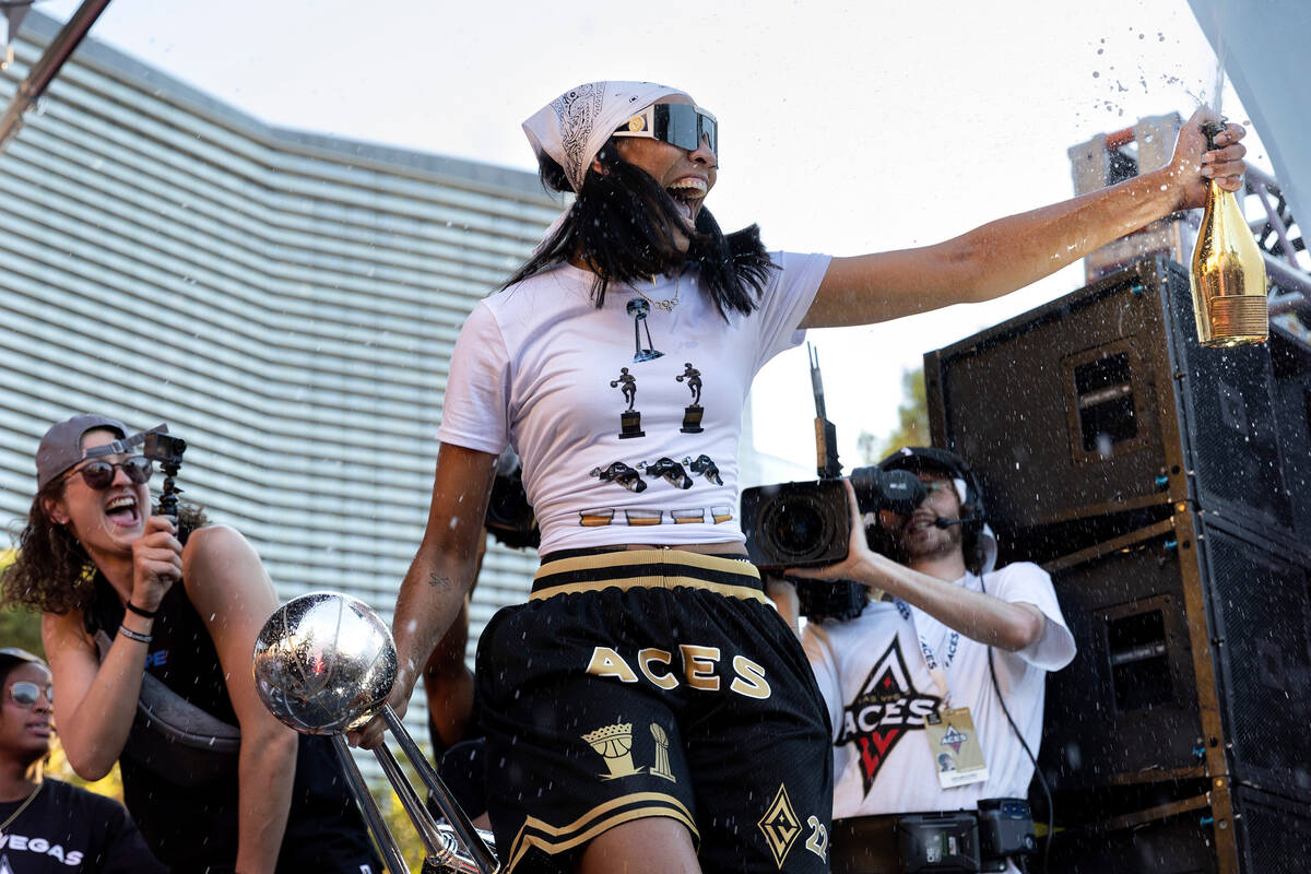 Las Vegas Aces forward and 2022 WNBA MVP A'ja Wilson, holding the 2022 WNBA Championship trophy ...