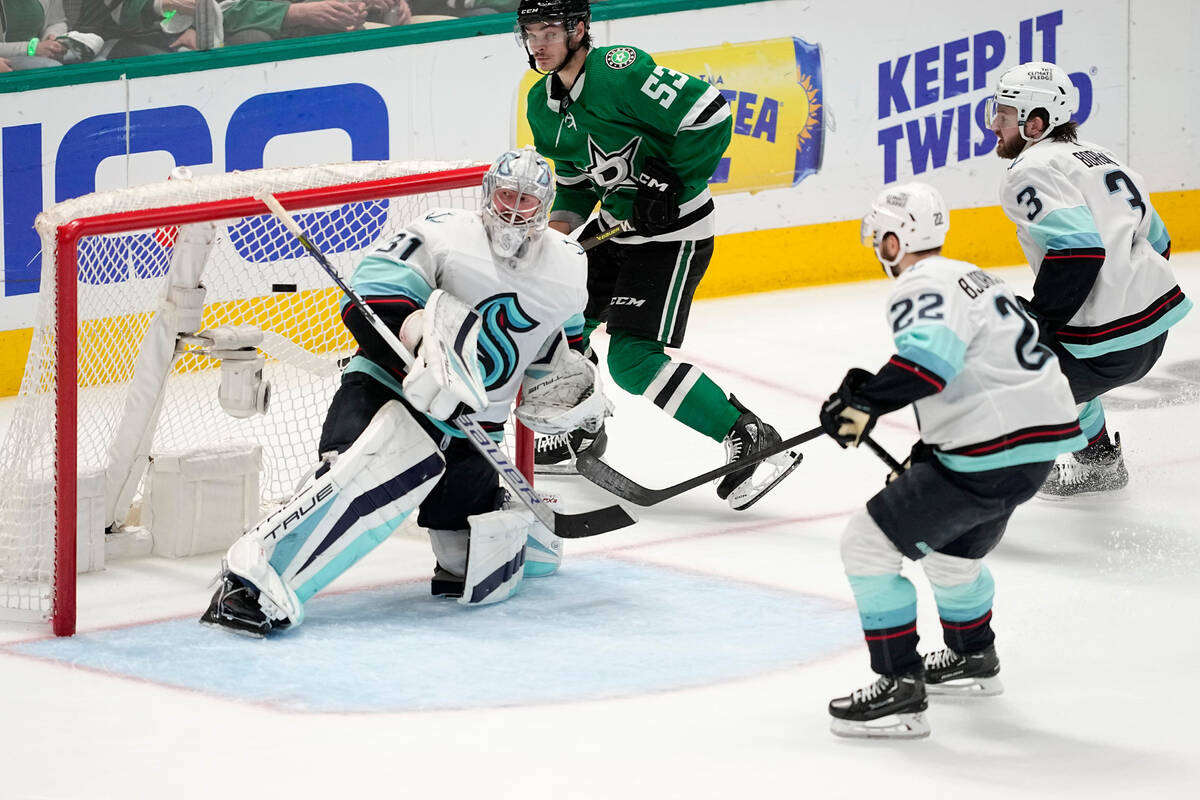 Dallas Stars center Wyatt Johnston (53) scores against Seattle Kraken goaltender Philipp Grubau ...