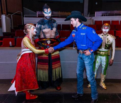 Cast members with "KA" greet Stetson Wright to celebrate the National Finals Rodeo at the Palms ...