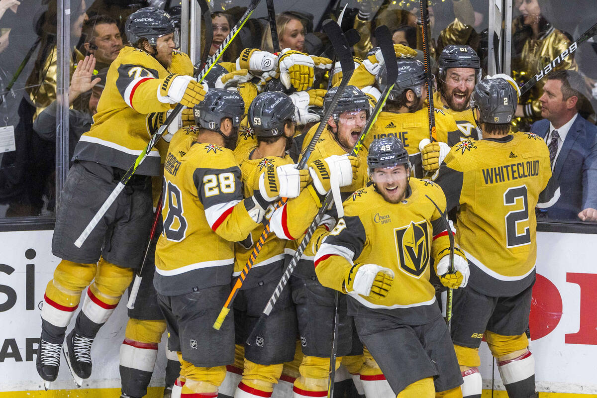 Golden Knights teammates celebrate center Brett Howden (21) for a score against the Dallas Star ...