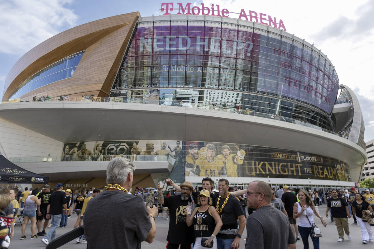 Fans pose for photos before Game 1 of the Western Conference Final playoff series between the G ...