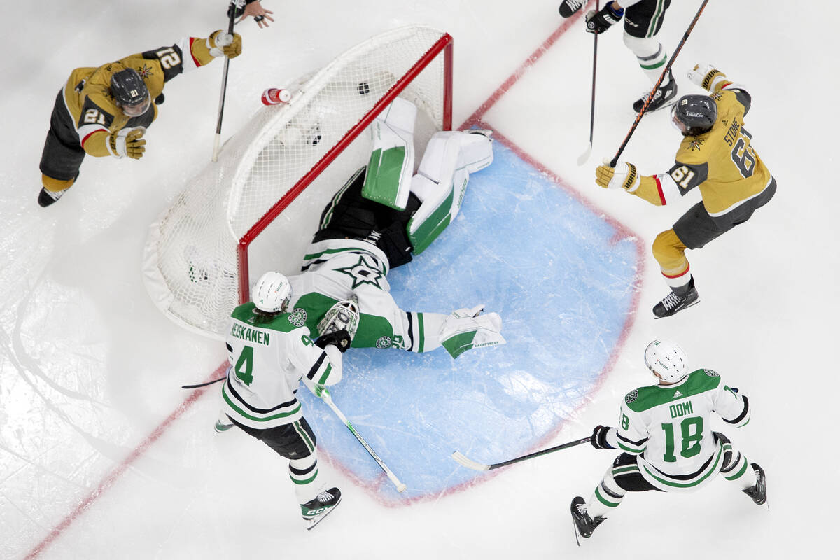 Golden Knights center Brett Howden (21) and right wing Mark Stone (61) celebrate after Dallas S ...