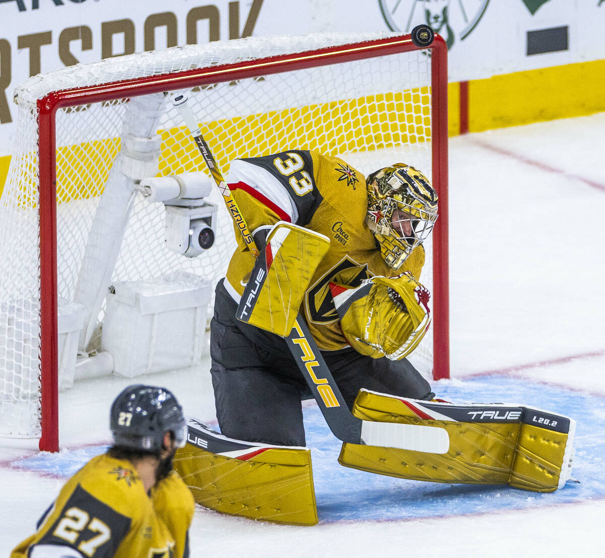 Golden Knights goaltender Adin Hill (33) stops another shot on goal from the Dallas Stars durin ...