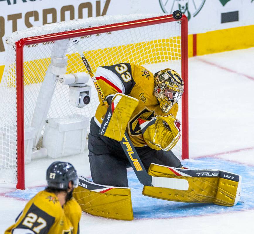 Golden Knights goaltender Adin Hill (33) stops another shot on goal from the Dallas Stars durin ...