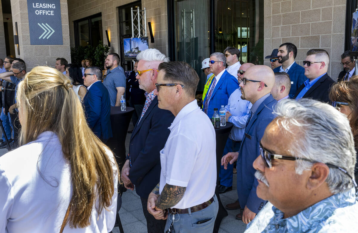 Invited guests look on as the Southern Land Company conducts a ceremonial groundbreaking for tw ...