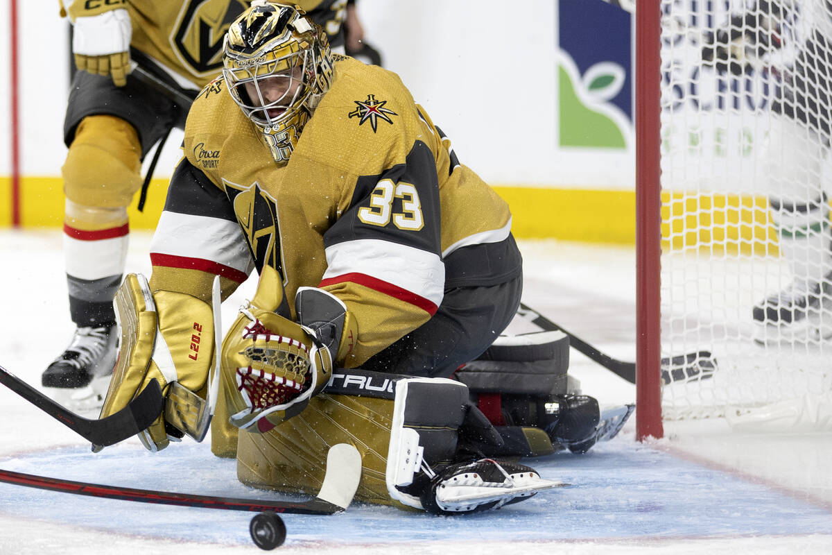 Golden Knights goaltender Adin Hill (33) makes a save on a Dallas Stars shot during the second ...