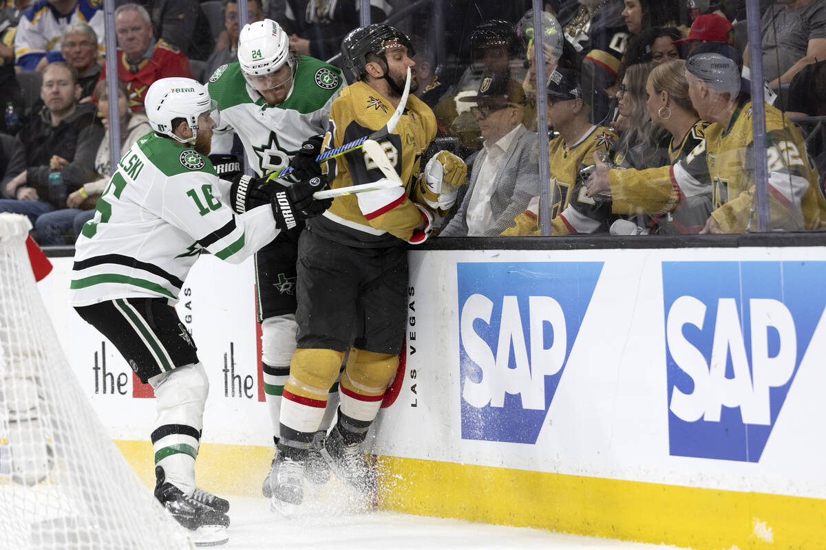 Dallas Stars centers Roope Hintz (24) and Joe Pavelski (16) hit Golden Knights defenseman Alec ...