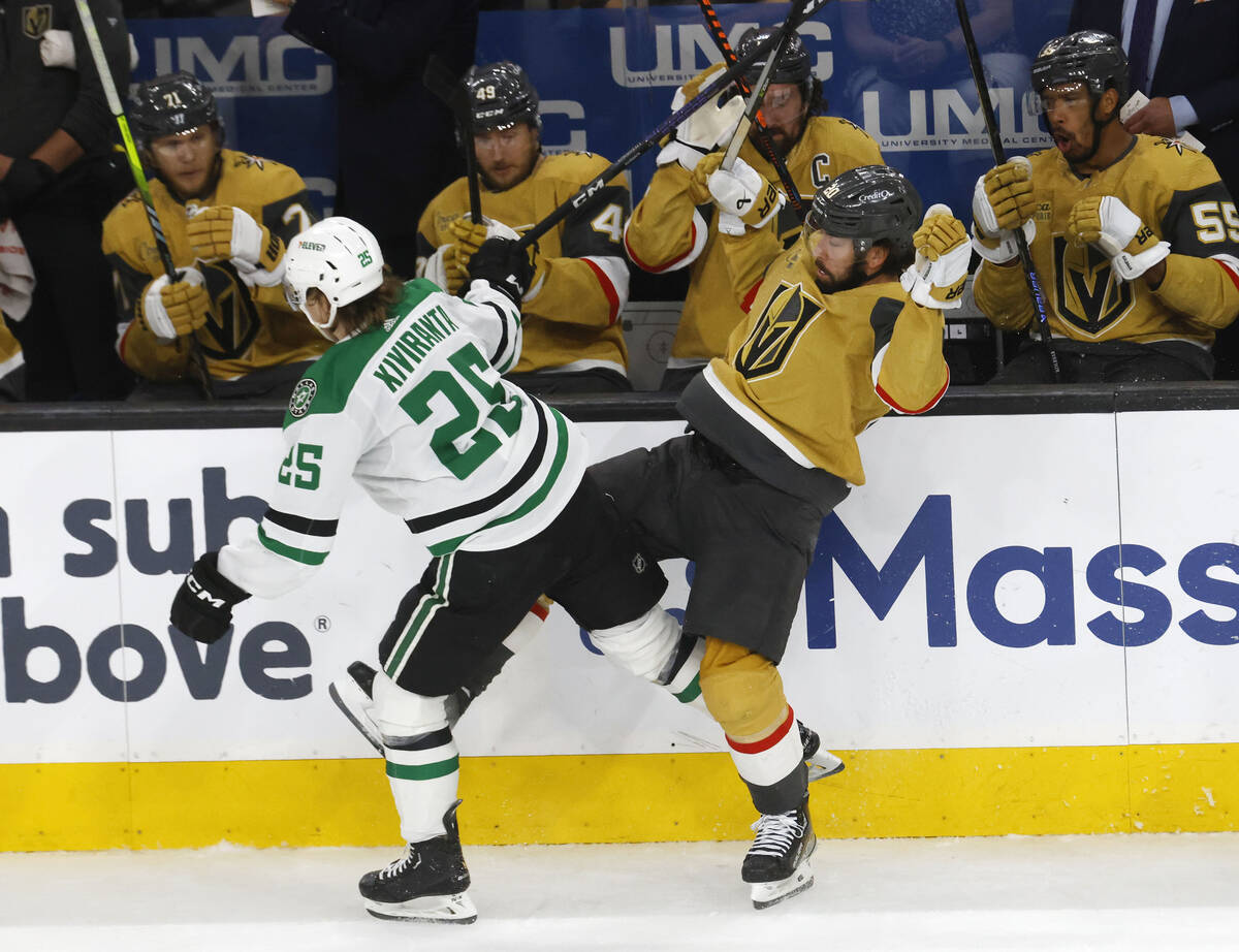 Dallas Stars left wing Joel Kiviranta (25) tangles with Golden Knights center Chandler Stephens ...