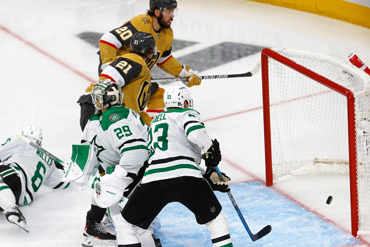 Golden Knights center Chandler Stephenson (20) scores a goal against Dallas Stars goaltender Ja ...