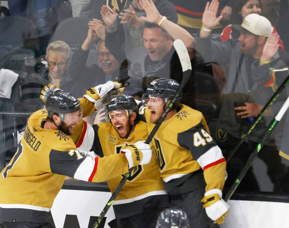 Golden Knights right wing Jonathan Marchessault (81), center, celebrates his teammates, Golden ...