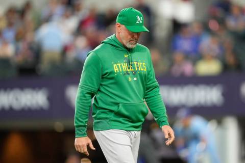Oakland Athletics manager Mark Kotsay walks to the dugout after a pitching change against the T ...