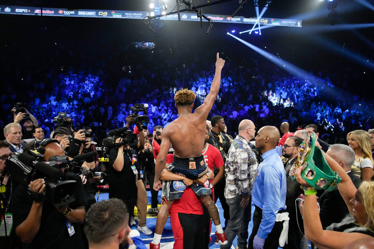 Devin Haney celebrates after defeating Vasiliy Lomachenko in an undisputed lightweight champion ...
