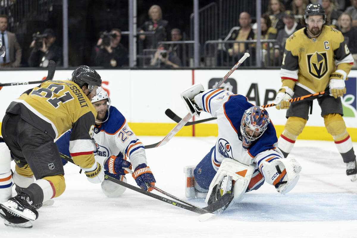 Edmonton Oilers goaltender Stuart Skinner (74) makes a glove save against Golden Knights right ...