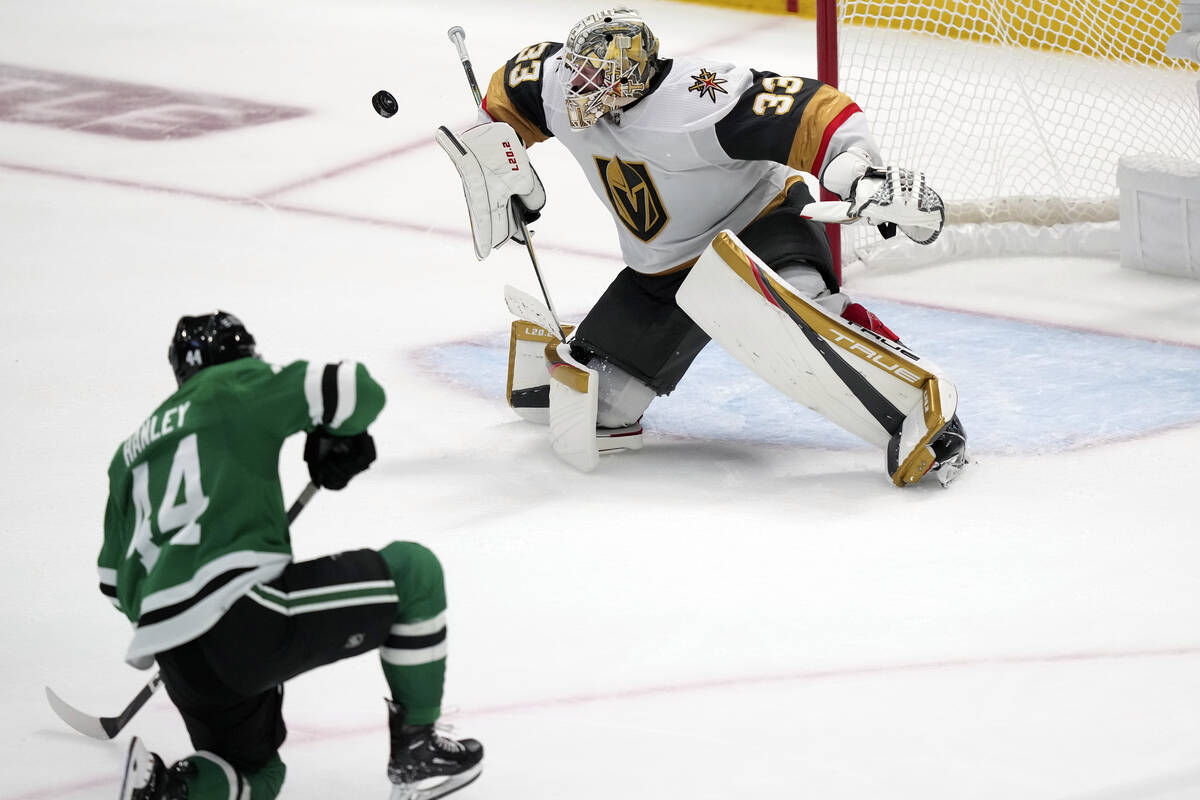 Vegas Golden Knights goaltender Adin Hill blocks a shot by Dallas Stars defenseman Joel Hanley ...