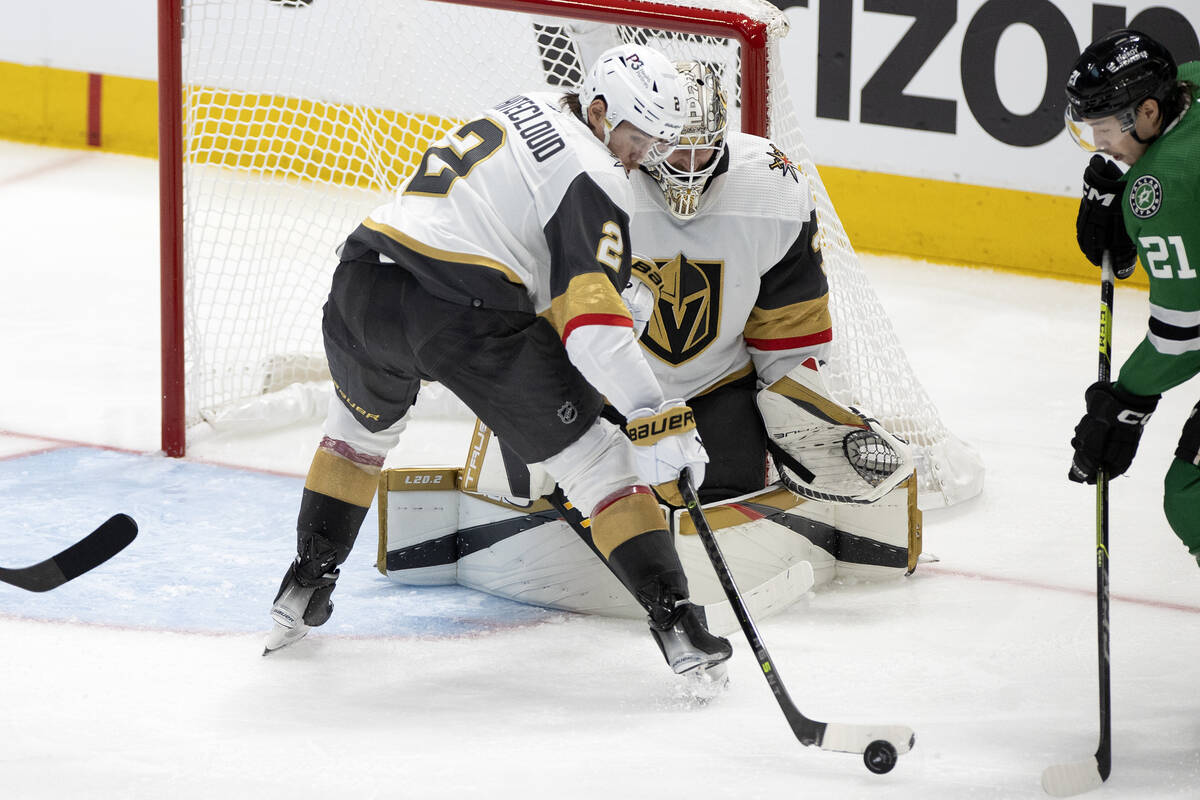 Golden Knights defenseman Zach Whitecloud (2) blocks the puck on a Dallas Stars left wing Jason ...