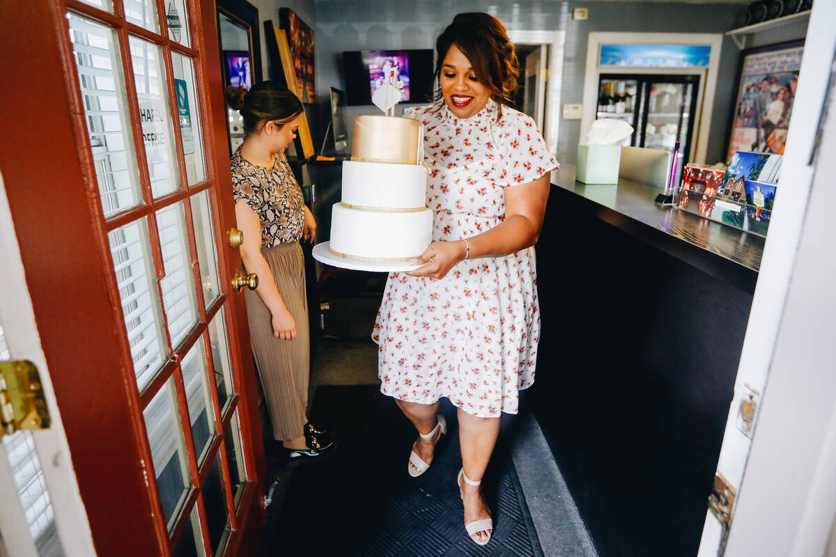 Yvette Smith carries a cake out to a celebration on Monday, May 22, 2023, at the Little Chapel ...