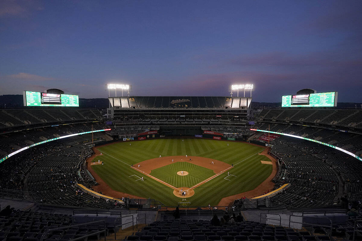 Fans at RingCentral Coliseum watch a baseball game between the Oakland Athletics and the Cincin ...