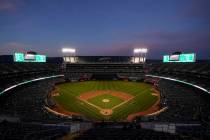 Fans at RingCentral Coliseum watch a baseball game between the Oakland Athletics and the Cincin ...