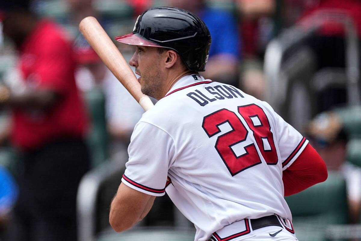 Atlanta Braves' Matt Olson drives in a run with a double during the first inning of a baseball ...